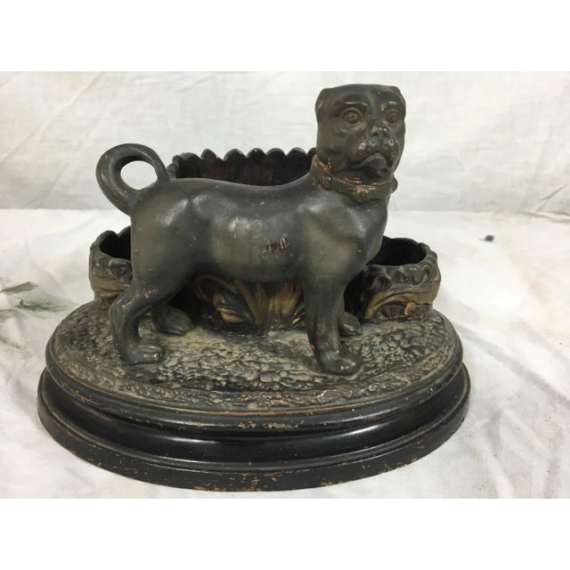19th century French terra cotta match safe with dog standing in front of three baskets. Age wear.