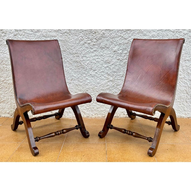Elegant pair of lounge chairs by Valenti, one of Spain's most renowned furniture manufacturers of the 20th century. These...