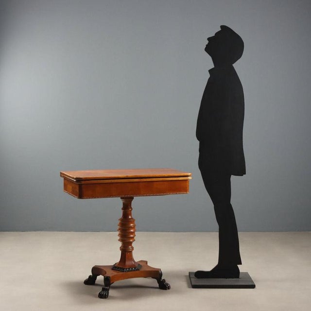 Mid-19th century English citronnier game table. The swivel and flip-top reveals a practical open compartment, ideal for...