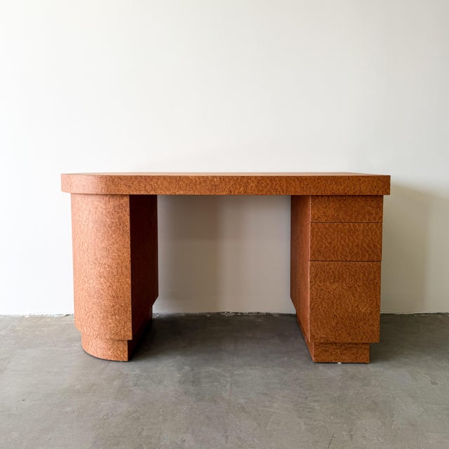 A striking vintage 1980s burlwood desk featuring a clean-lined postmodern silhouette and beautiful burl veneer throughout....