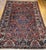 "Presenting the Oversize Vintage Persian Bakhtiari rug, hand-knotted circa the mid-1900s. The rug's expansive field is set...
