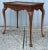 Very fine and exceptionally well executed vintage solid cherry Queen Anne style tea table. Graceful carved cabriolet legs...