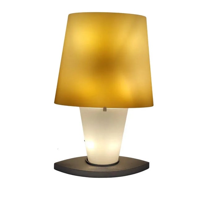 Exceptional table lamp, model 3064, designed by Daniela Puppa for Fontana Arte. Daniela Puppa reduces the piece to its...