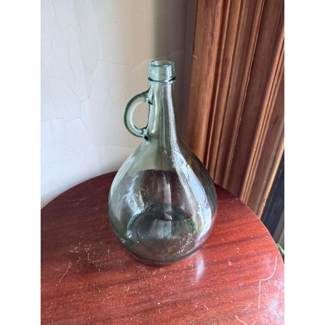 1977 California glass one gallon jug produced by Glass Containers Corporation at the Fullerton plant. Clear glass with...