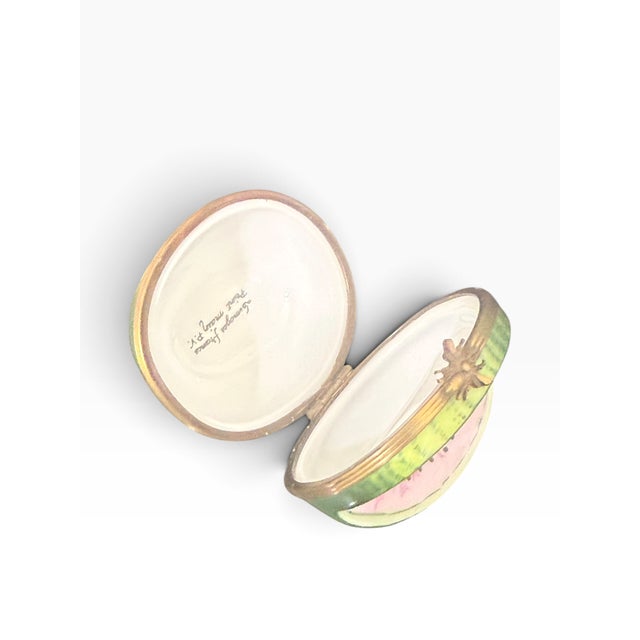 Celebrate the artistry of French porcelain with this charming hand-painted Limoges watermelon trinket box. Crafted in...