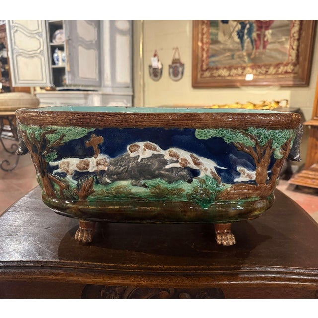 Decorate a hunting lodge or ranch with this colorful antique planter. Crafted in Sarreguemines, France circa 1880, the...