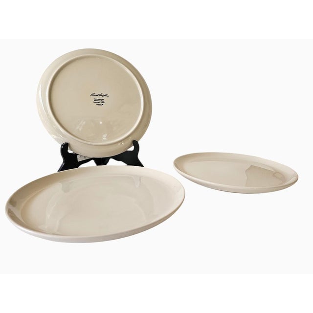 Set of three Russel Wright Oneida MCM style stoneware 11-1/2" diameter dinner plates in linen white. . These were...