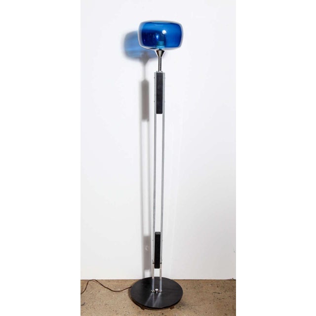 Scandinavian Modern Nickel-plated Floor Lamp with translucent Blue Glass Sphere Shade. Featuring two Nickel parallel bar...