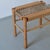 Vintage carved wood stool with a woven seat. The right one is available.