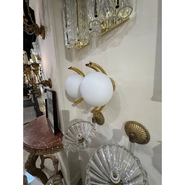 Lovely pair of Modern Murano glass and brass ball form sconces in matte white. Note: Custom colors available.