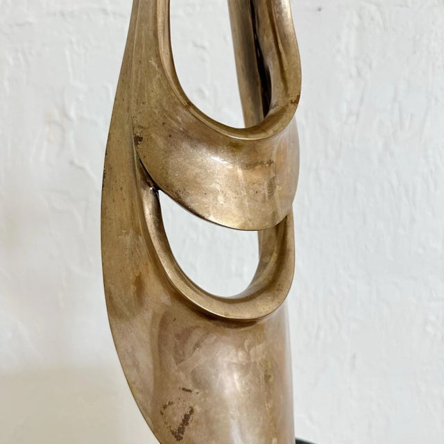 Tom Bennett bronze abstract sculpture from the 1980s. American. Bronze free-form on a black marble base. Signed edition...
