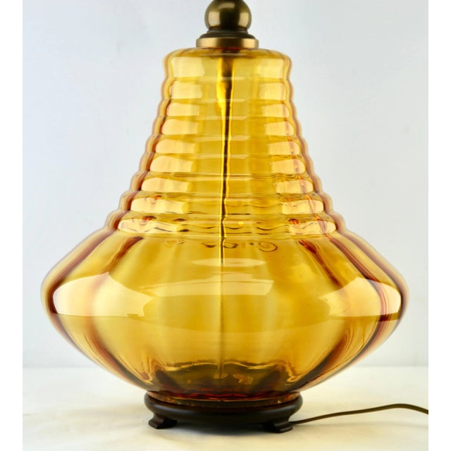 Italian glass table lamp with optical vertical-horizontal ribs with a light amber tint Made by Empoli in the midcentury....