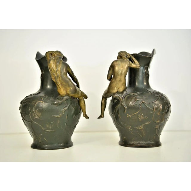 Pair Art Nouveau Pitchers Charles Theodore Perron 1900s. Extremely rare pair, of what seems to be spelter base or pewter,...