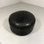 Round black patchwork leather pouf by De Sede, Switzerland. 1970’s. In good condition with light wear of use/age; patina...