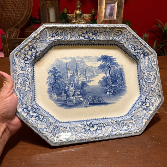 Antique English Blue Transfer Ironstone Octagonal Platter, River and Castle Scene, Circa Mid-19th Century A handsome and...