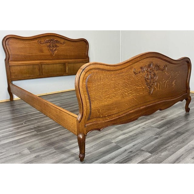 This Vintage French Louis double bed frame features elegant carved detailing and graceful curves, offering classic French...