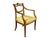 A 19th-C. Swedish Neoclassical walnut arm chair with hand carved gilded details.