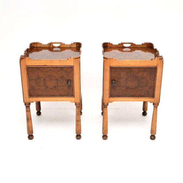 A wonderful pair of antique Georgian style yew wood oyster veneer side cabinets. They were made in England, and date from...