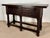 Striking Spanish console table from the late 19th century, crafted in solid walnut and inspired by traditional Baroque...