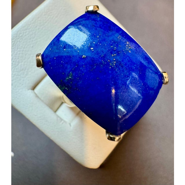 Introducing our exquisite Estate Lapis Lazuli Ring, crafted in 14 Karat Yellow Gold. This stunning ring features a...