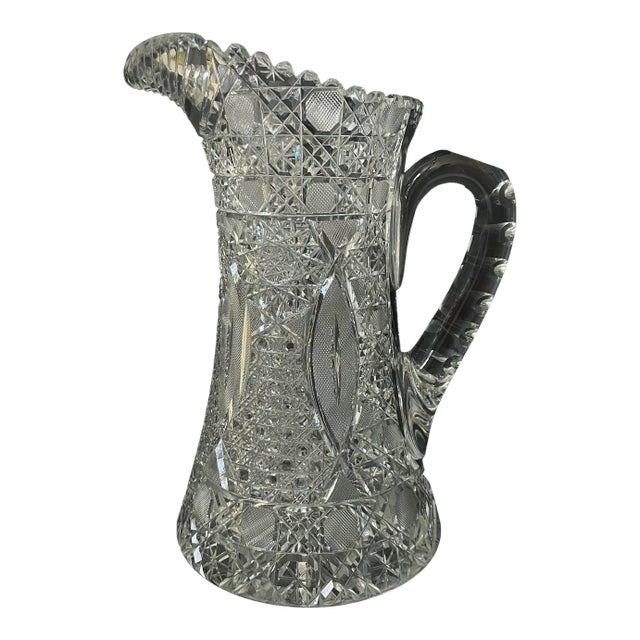 This Antique 10.5" Pitcher is a stunning example of American Brilliant Period Cut Glass craftsmanship. Handmade in the...