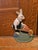 Bring a touch of whimsical charm to your home with this vintage, heavy cast-iron gardening rabbit, thoughtfully sculpted...