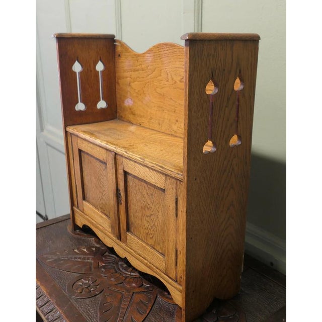 Beautifully Designed Arts and Crafts Wall Cabinet A great little piece, made in Golden Oak with pierced carving to the...