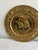 A handsome pair of vintage English brass plates with raised sailing ships at their centers, one a two-masted vessel and...