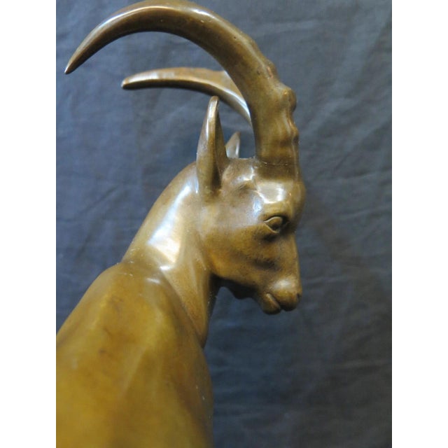This vintage early 20th century work of art depicts a well defined bronze animal sculpture signed by L. Miller, the...