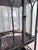 A spectacular oversized Gothic-style iron and glass vitrine with soaring cathedral-window tracery and a dramatic...
