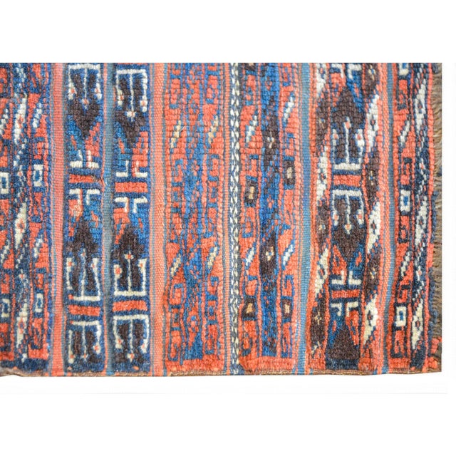 A charming late 19th century Persian Turkmen rug with a beautiful pattern containing myriad geometric stripes woven in...