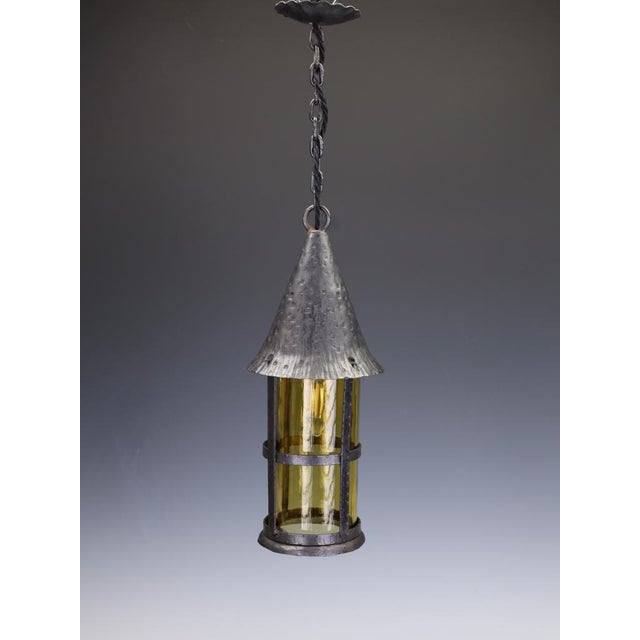 Antique Arts & Crafts Wrought Iron & Hand-Blown Amber Glass Pendant Lantern An exceptional late 19th or early 20th-century...