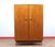 Discover a stunning armoire that perfectly captures the timeless elegance of Mid Century Modern design. Crafted from rich...
