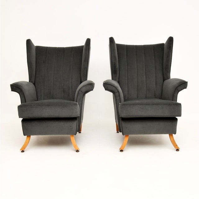 A stylish and very well made pair of vintage Italian velvet wing back armchairs, dating from the 1960’s. They are of...