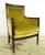 Antique French style arm chair with yellow velvet upholstery and a carved dark wood tone frame. Good condition with some...