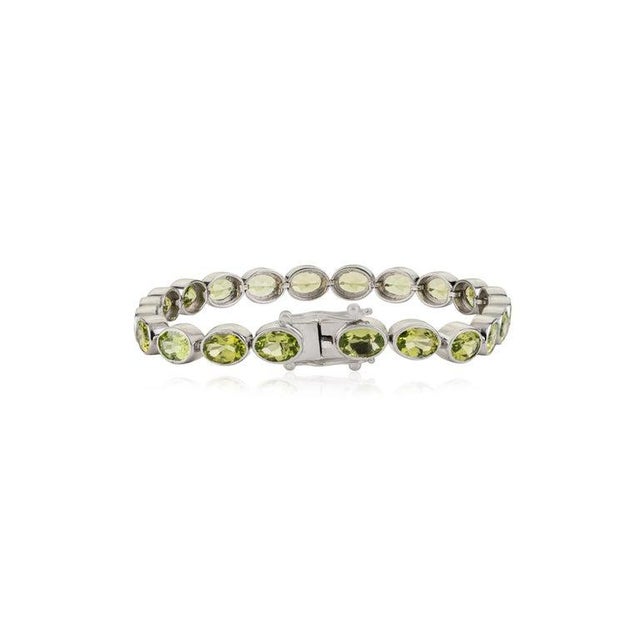 Green Oval Cut Peridot Gemstone Tennis Bracelet in 925 Sterling Silver by Caratandher For Sale - Image 8 of 11