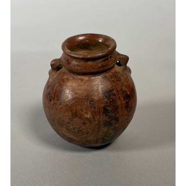 Quimbaya culture, Colombia, Central Cauca Valley. Circa 500-1500 AD. Jar-shaped vase in the form of a seated...