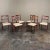 Set of 6 Antique French Empire Revival Mahogany Dining Chairs represent a tailored expression of the style, featuring...