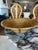 A vintage pencil reed rattan bowl with brass trim, defined by its coiled construction and warm natural tone. The form is...