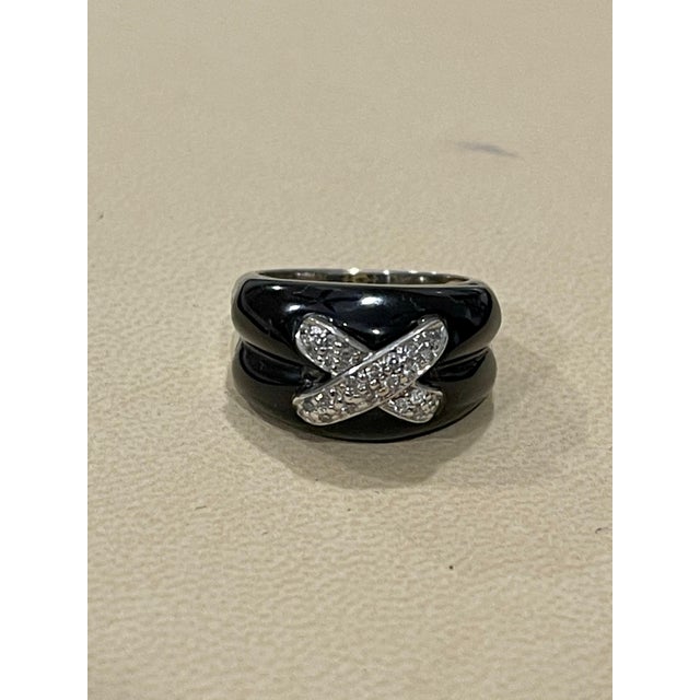 Approximately 0.2 Carat White Diamond and Black Onyx Ring 18 Karat White Gold size 5 &1/2 18 K gold 9.3 Grams, Stamped for...