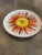 This is a beautiful vintage Italian ceramic plate with a hand painted floral detail on the top center of the plate. It has...