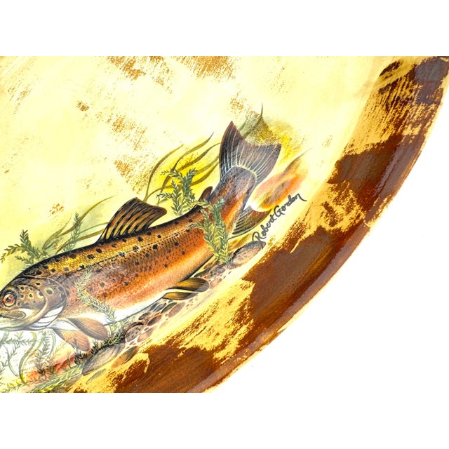 This striking ceramic fish platter by Robert Gordon Australia captures rustic charm with a hand-painted trout swimming...