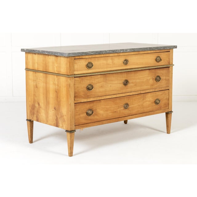 18th century french cherrywood commode an 19th century french louis xvi period cherrywood commode. the top has an...