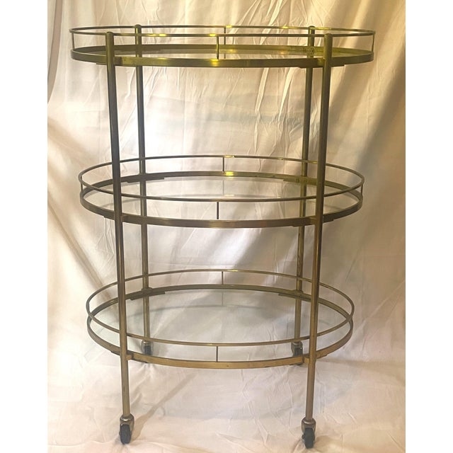 Welcome this exceptional Maxwell Phillips Mid-Century Modern Bar Cart Tolley to your home. This multi-functional hostess...