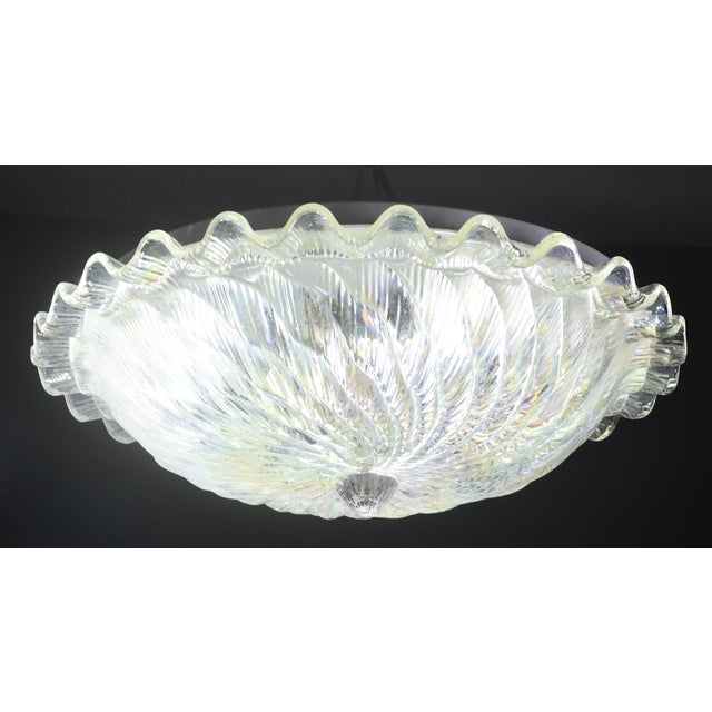 Stunning iridescent Murano ceiling light. The special iridescent color makes the light shine with other colors when it is...