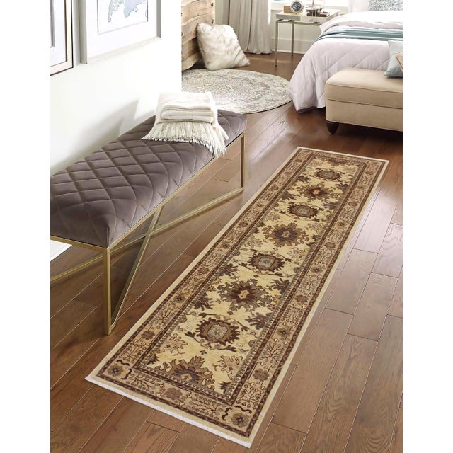 Enhance the ambiance of your home with this magnificent Persian-influenced Turkish hand-knotted rug made by skilled...