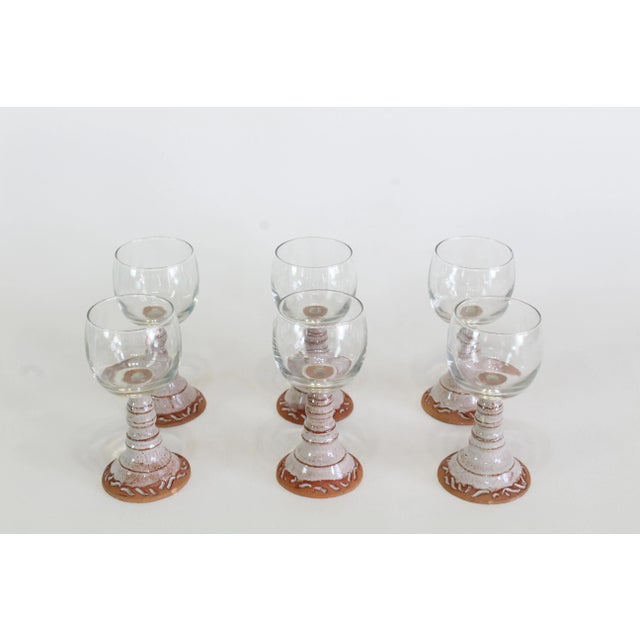 Vintage glass goblet with hand thrown pottery stems Dimensions; 3.5" Width x 3.5" Depth x 6.5" Height See pictures and...