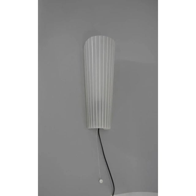 Glass wall lamp made in Europe circa 1970s. Minor chips on a glass on top edge and inside barely visible. Rewired: 1x40W,...