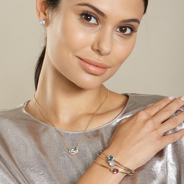 Created in 18kyg Rubellite 2 carats approx. Diamond 0.05 carat approx. Openable oval bracelet Hidden mechanism to open...