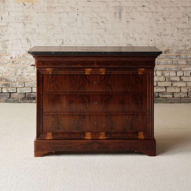 Add timeless French elegance to your space with this Louis Philippe period marble top commode, circa 1850, a beautifully...